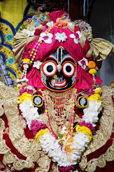 Detailed view of a colorful and adorned Jagannath deity sculpture, showcasing rich cultural heritage.