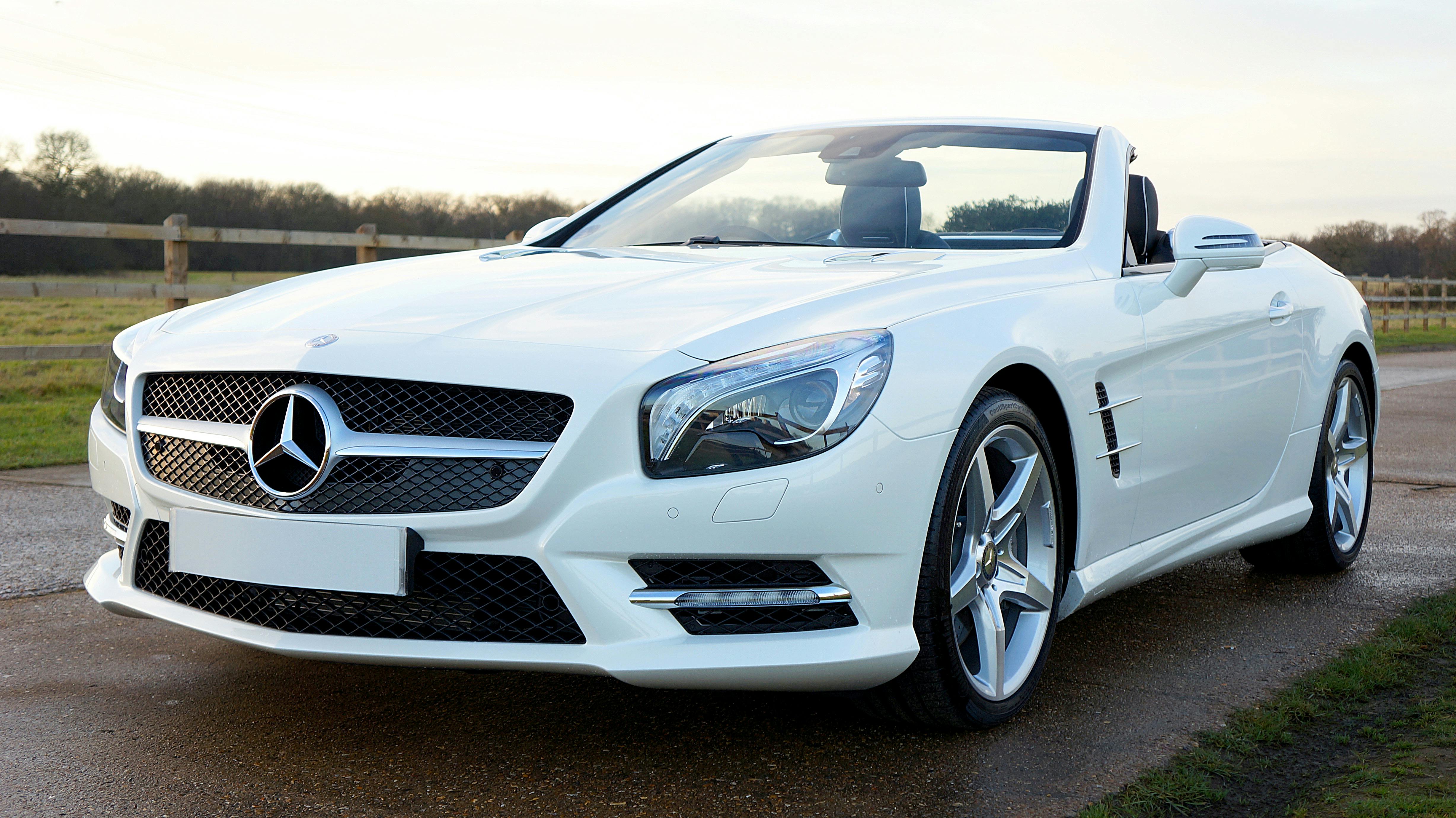 Silver Mercedez Benz Convertible on Brown Concrete Road · Free Stock Photo