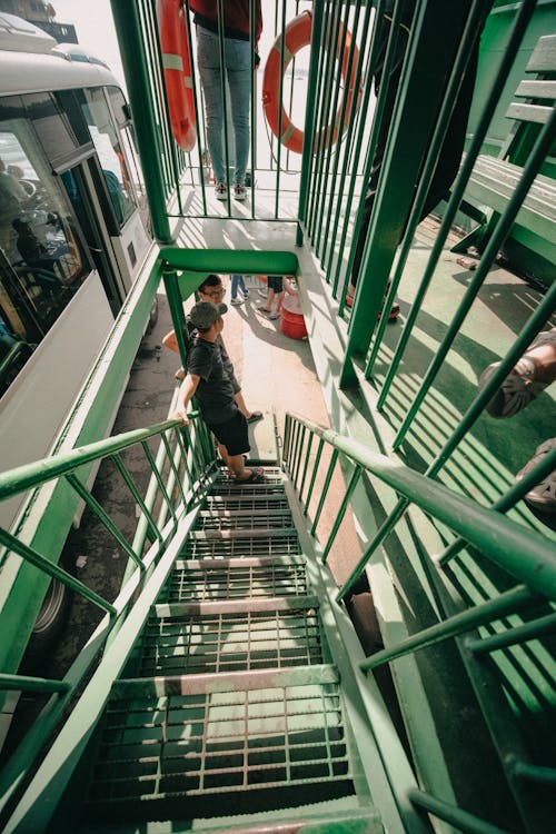 People Standing on Green Staircase