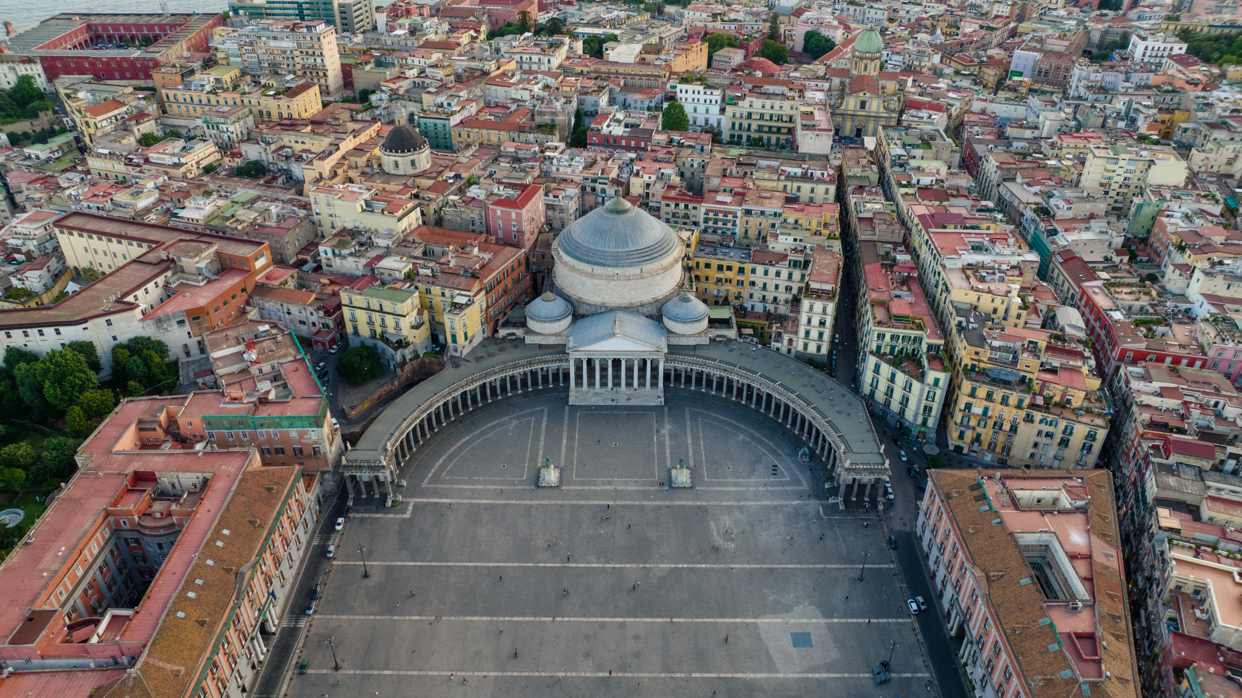 A stunning aerial shot of Piazza del Plebiscito and vibrant cityscape in Naples.