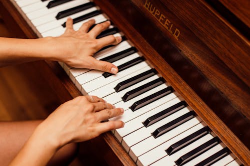 Free Close-Up Photo Of Person Playing Piano Stock Photo