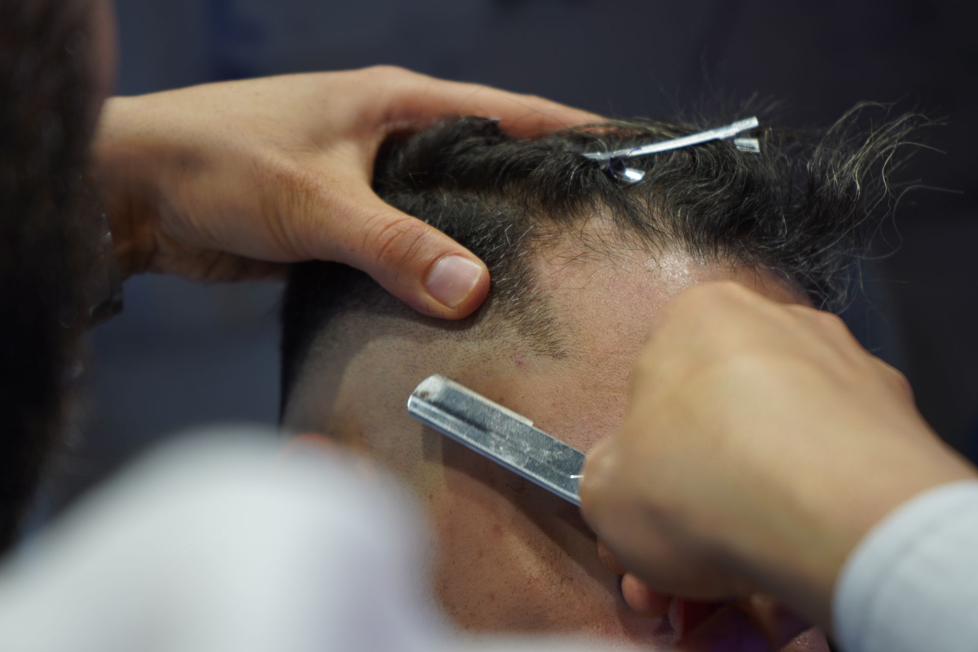 Close-Up Shot of a Person Having a Haircut