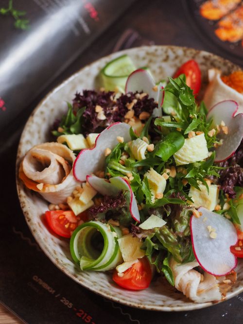 Free A fresh and tasty salad with mixed greens, cherry tomatoes, cucumbers, and radishes. Perfect for a healthy meal. Stock Photo