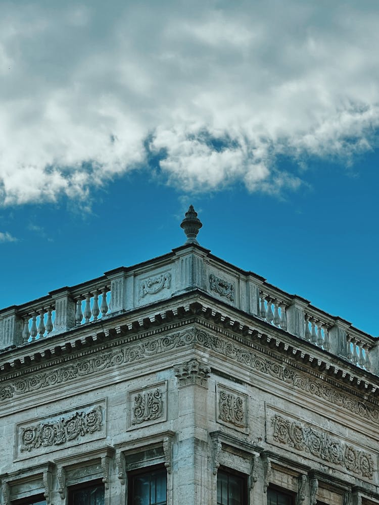 Cloud Over Ornamented Top Of Building