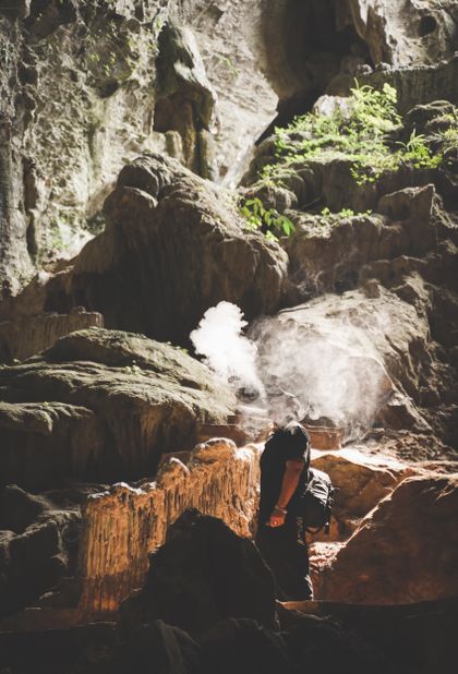 Cave passage lit from a single opening, photo by Hieu Duong on Pexels