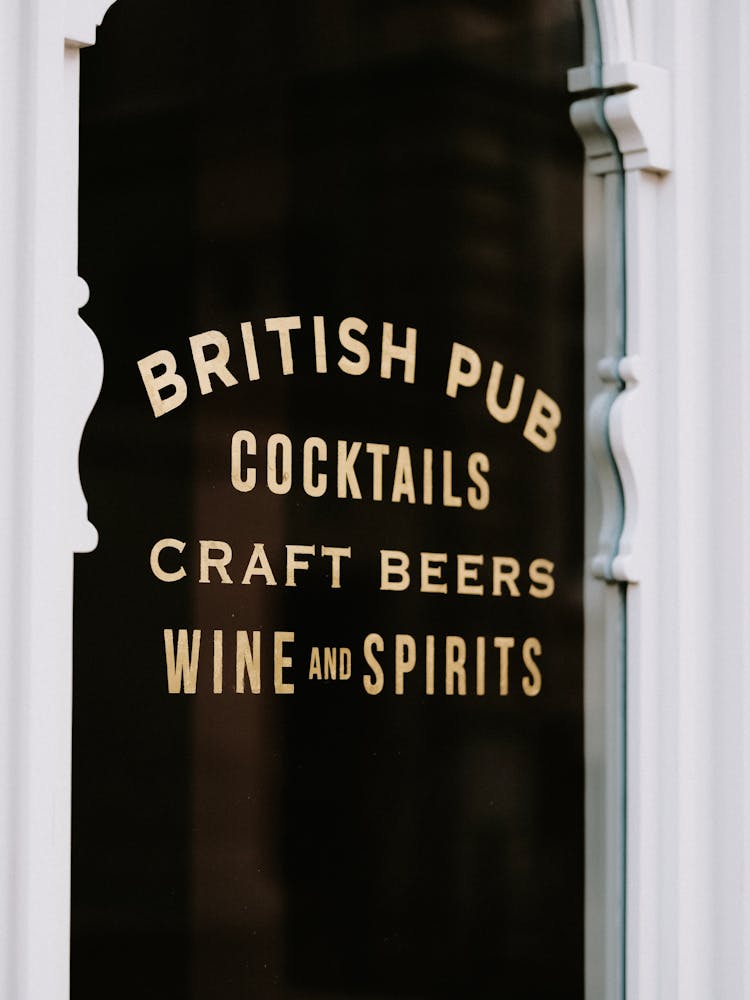 Signs On Entrance To Pub