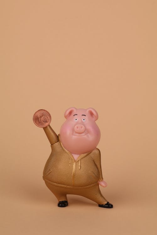 Free piggy in gold holding eurocent  Stock Photo