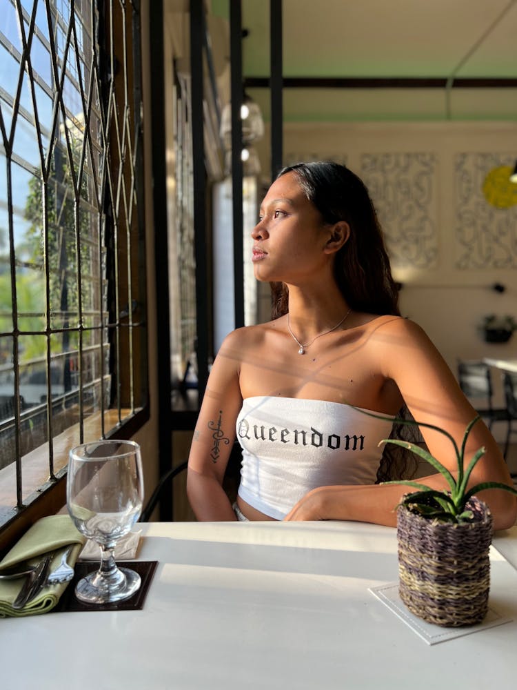 Woman Sitting In Restaurant