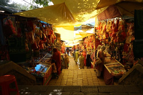 Foto profissional grátis de barracas, bazar, compras