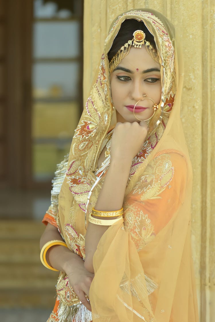 Woman In Yellow And Gold Sari