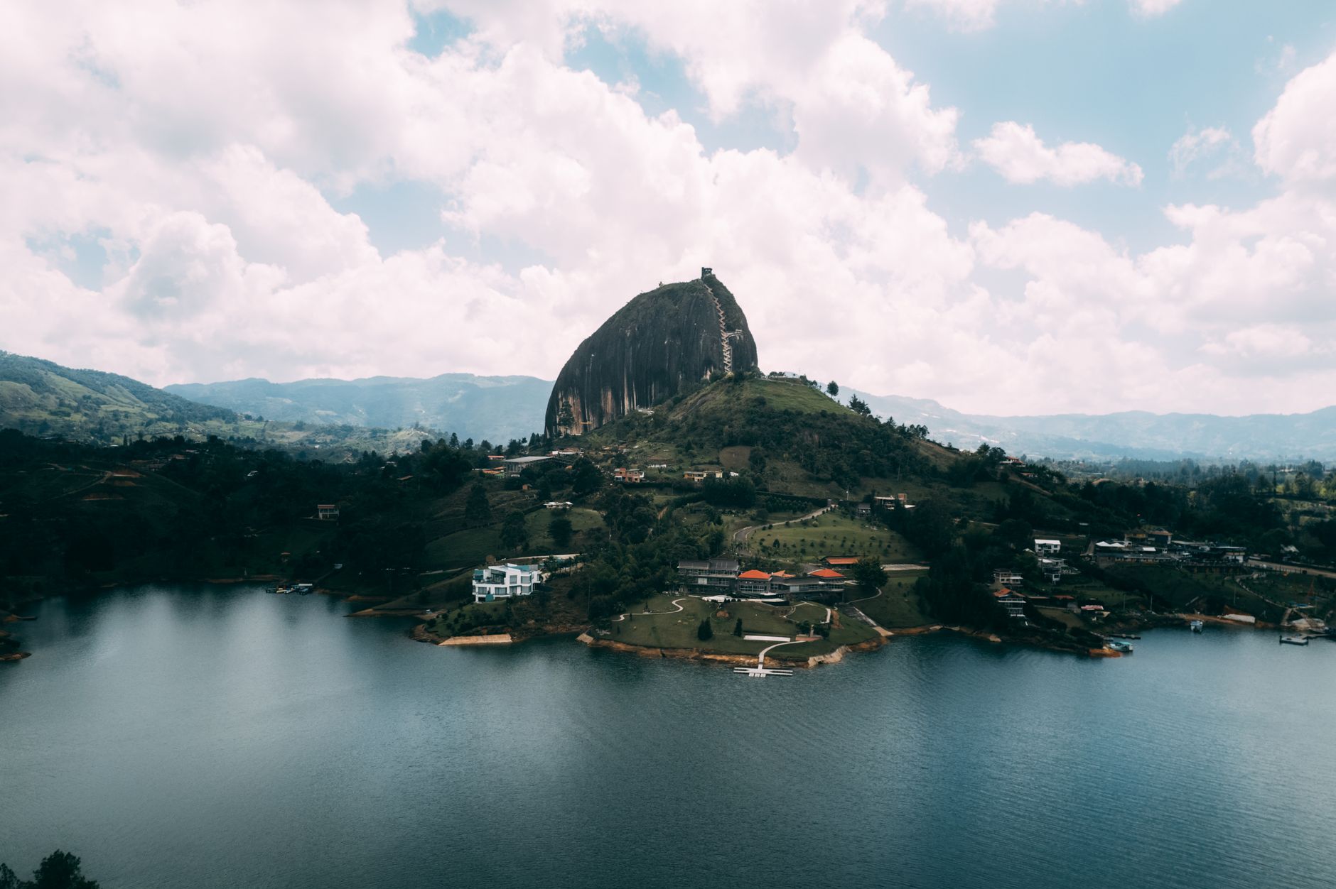 Stunning aerial view of the iconic El Peñol rock and surrounding landscape in Guatapé, Colombia.. Photo by Nick Wehrli on Pexels
