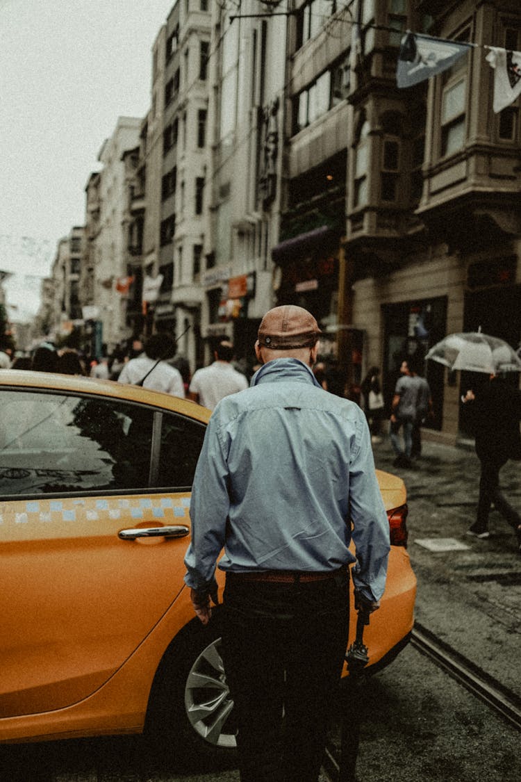 Man Standing Near Taxi