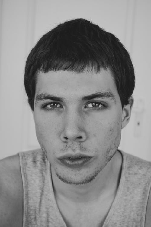 Portrait of Man Wearing Tank Top with Five OClock Shadow