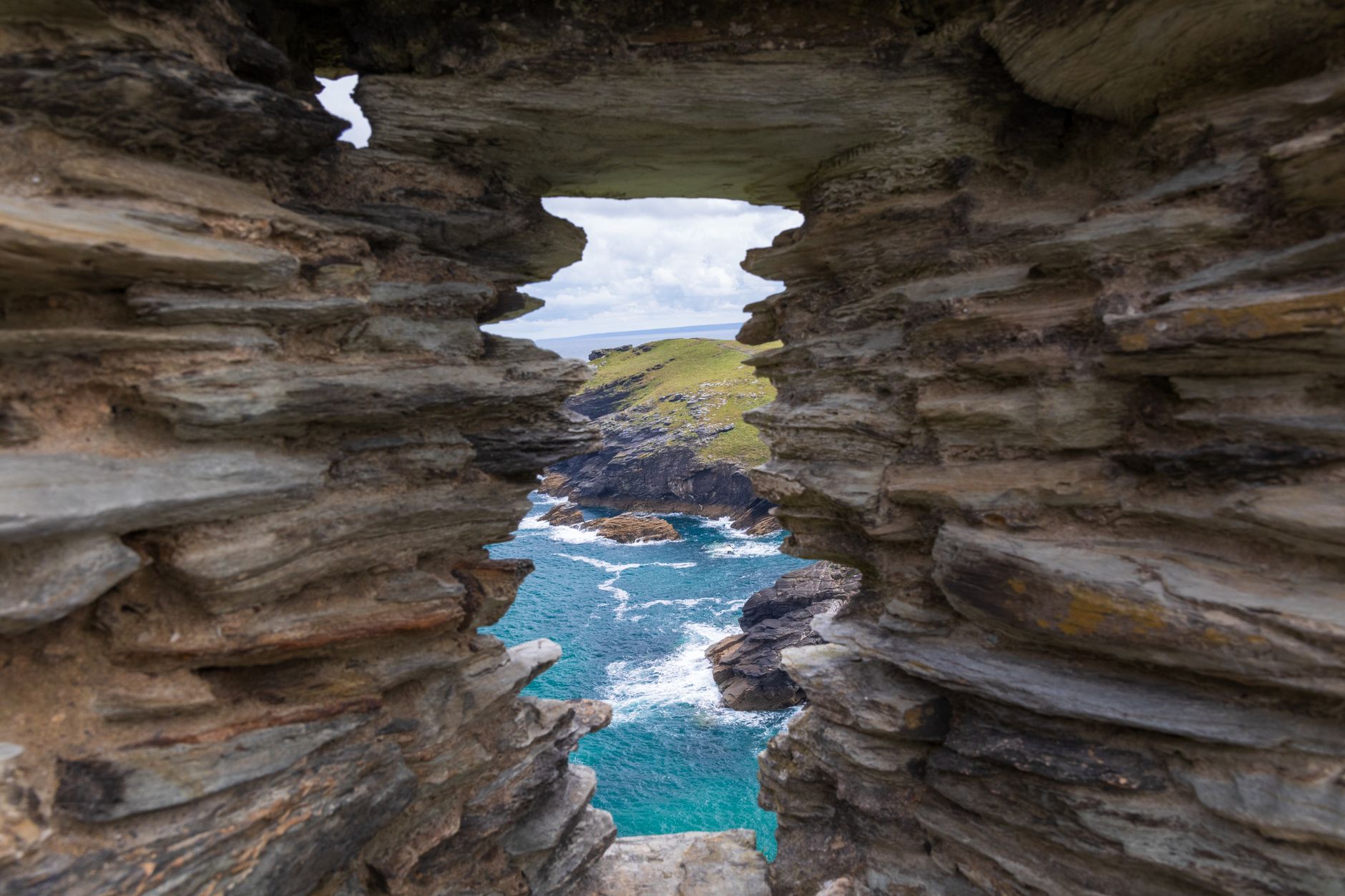 Tintagel Castle ruins framing the rugged Cornish coast near Bude