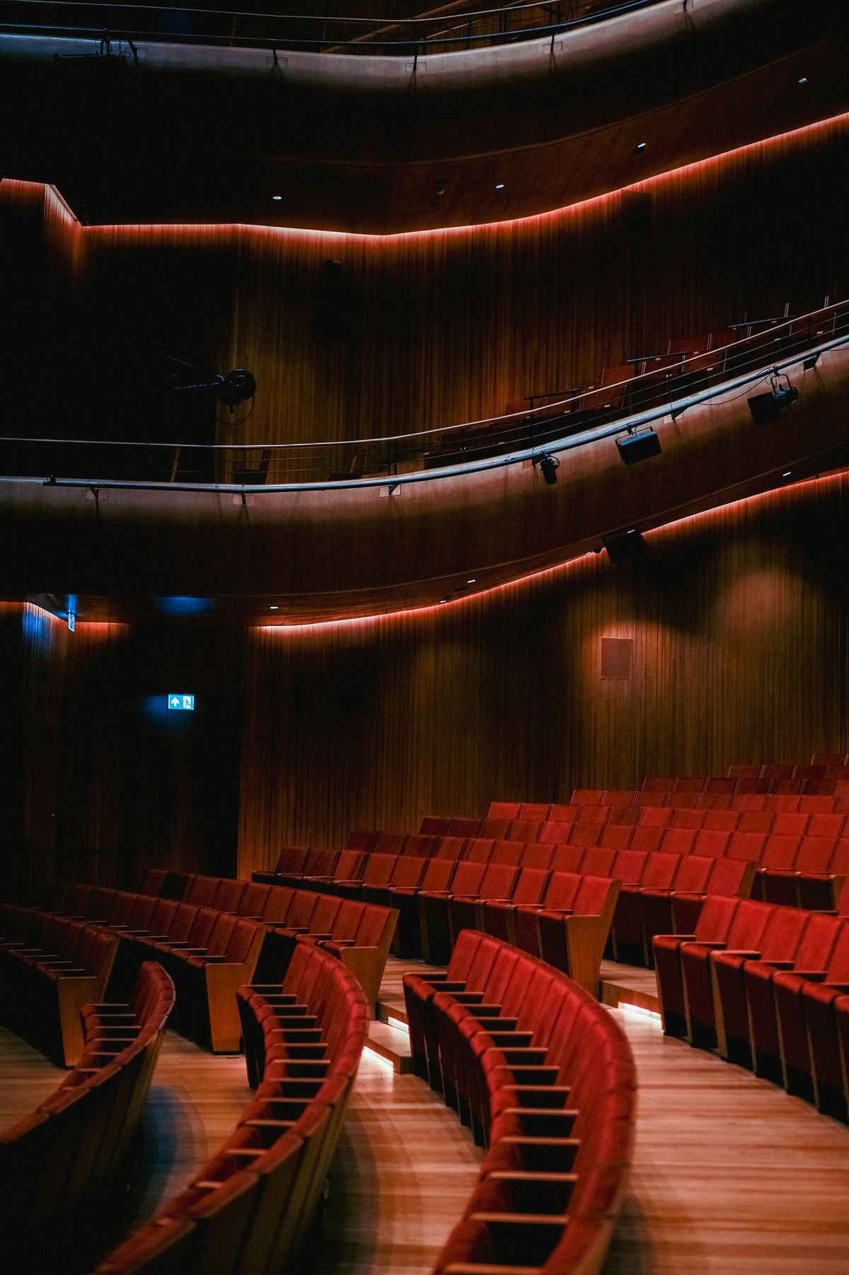 Rows of theater seats representing a paid, committed audience