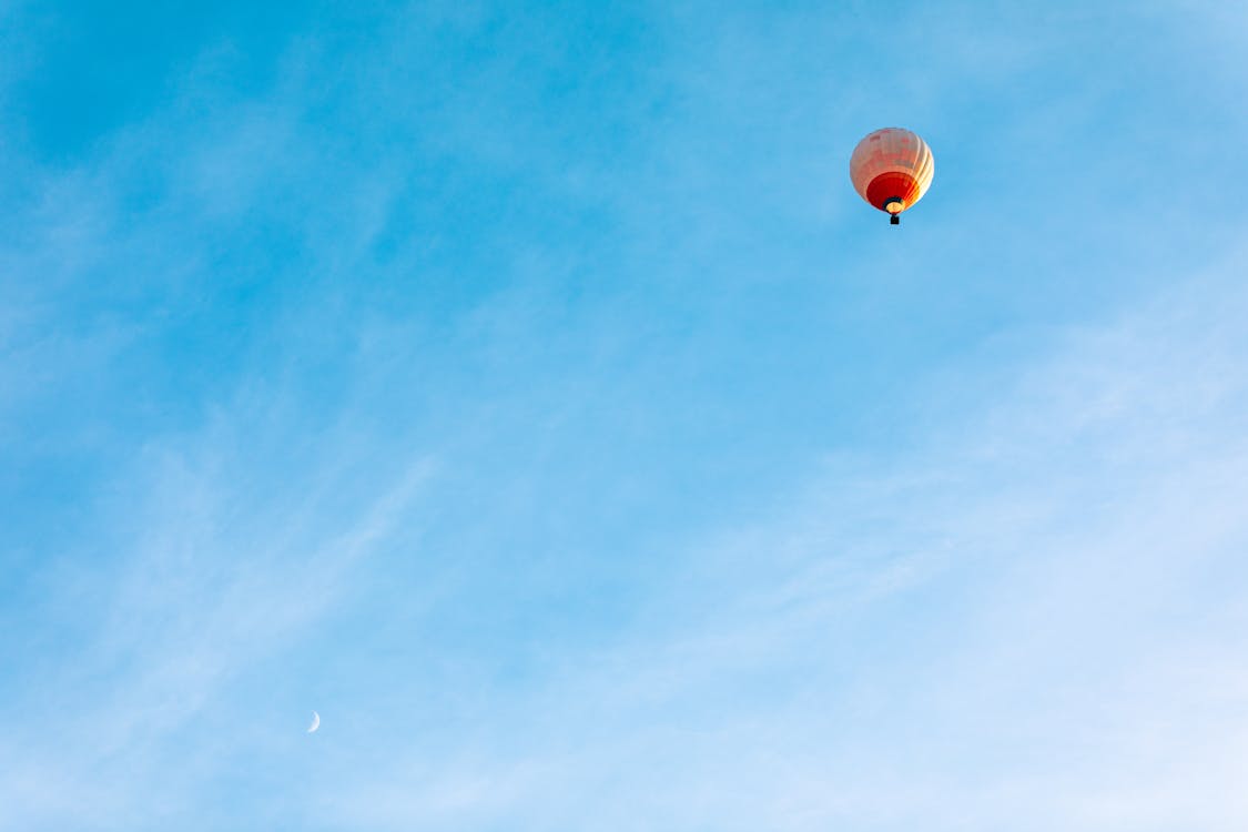 Hot Air Balloon in Mid Air Under Blue Sky