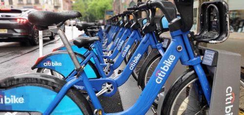 Free Row of parked Citi Bikes in Brooklyn, NY, during a rainy day. Stock Photo