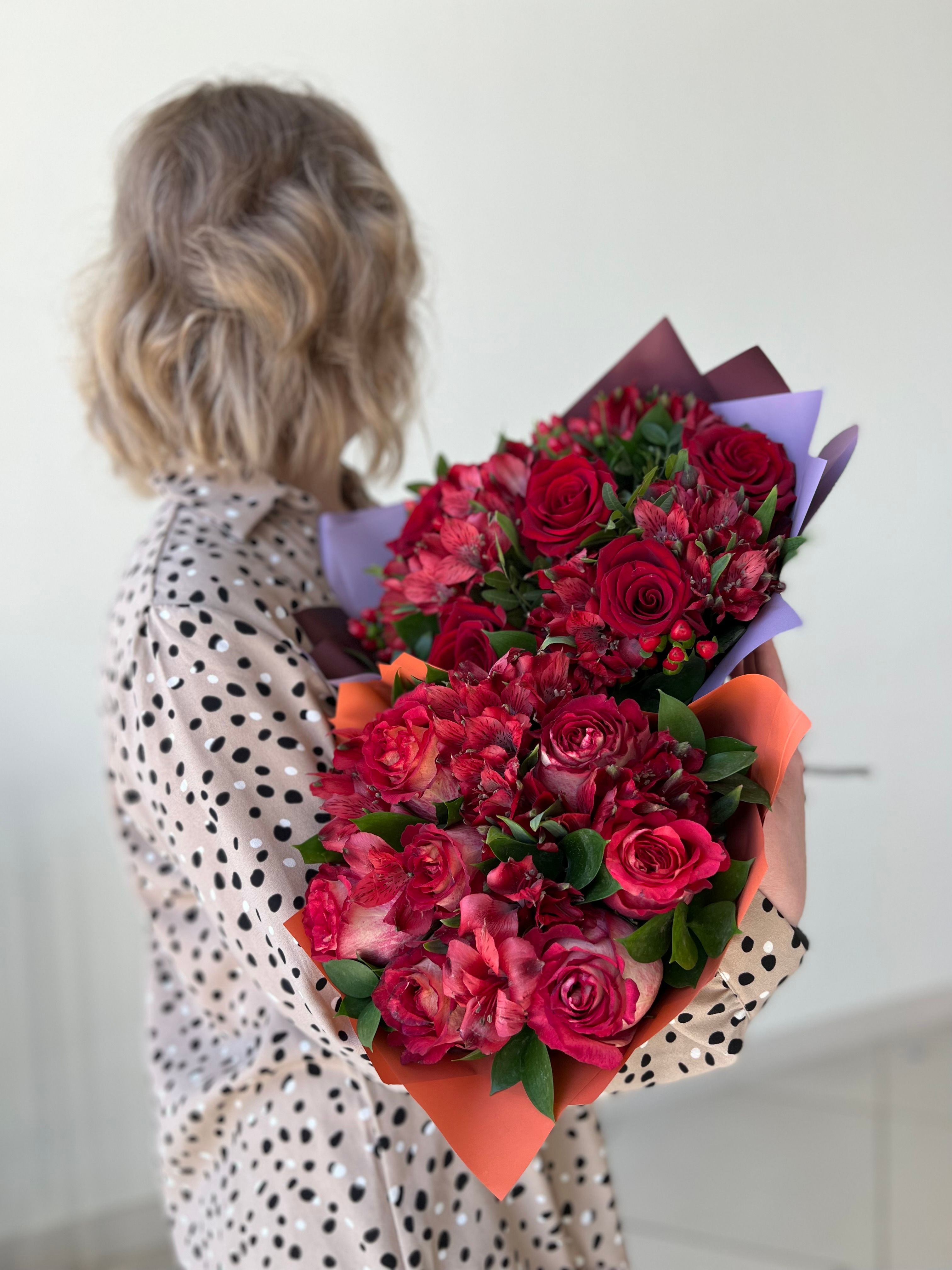 Young Woman Holding a Red Rose · Free Stock Photo