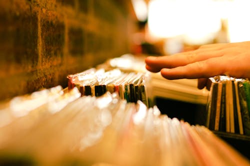 Free Hand Reaching Books Stock Photo