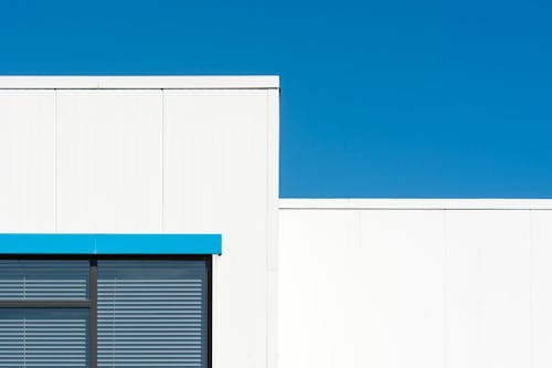 White Building Facade Against Blue Sky