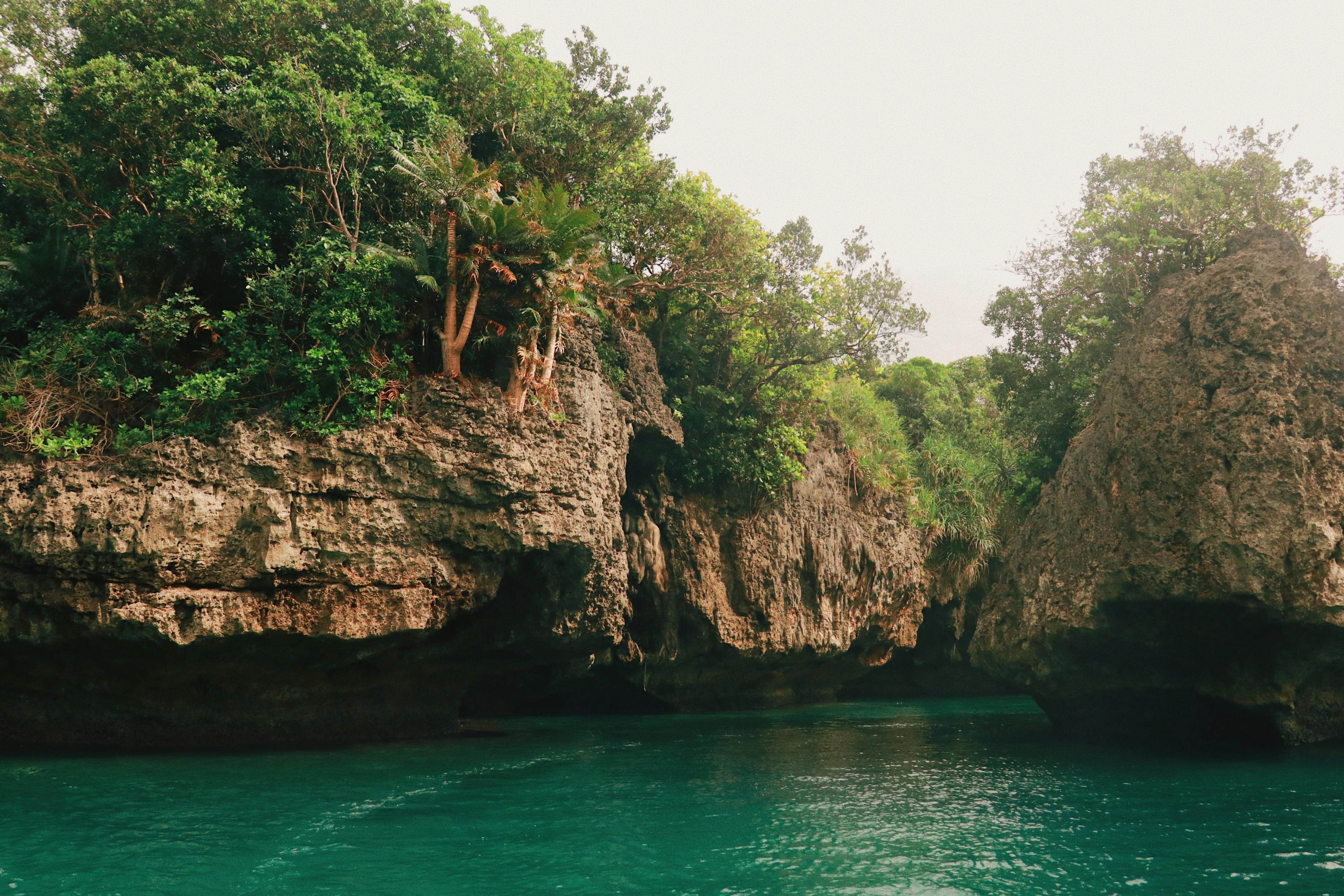 Idyllic lagoon with turquoise waters and rocky shores in Iloilo City, Philippines.