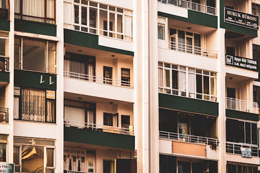 Close-up of a modern apartment building exterior with multiple balconies.