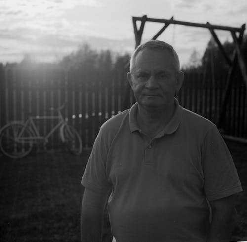 A Grayscale of a Man Wearing a Polo Shirt