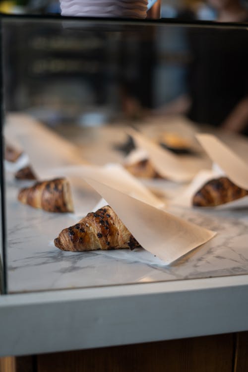 Free Croissant on a Parchment Paper in Tilt-shift Lens  Stock Photo