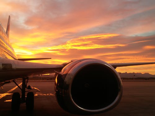 Free Airplane on an Airport at Sunset  Stock Photo