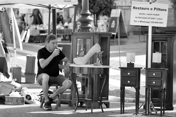 Man Selling Vintage Furniture On The Street 