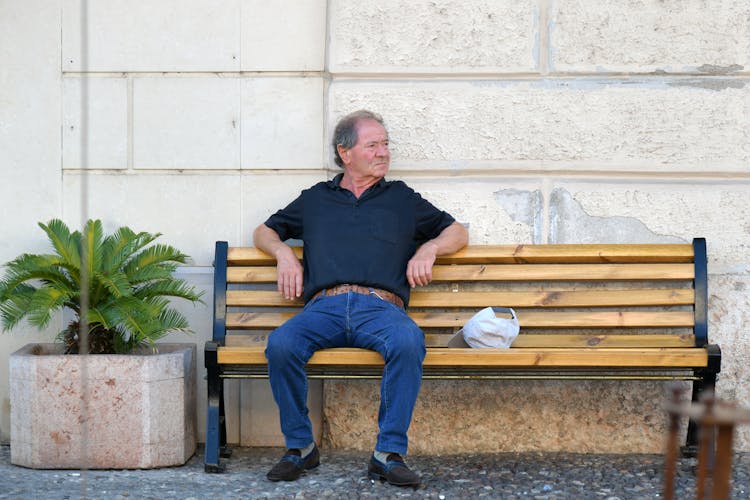 Elderly Man Sitting On The Bench