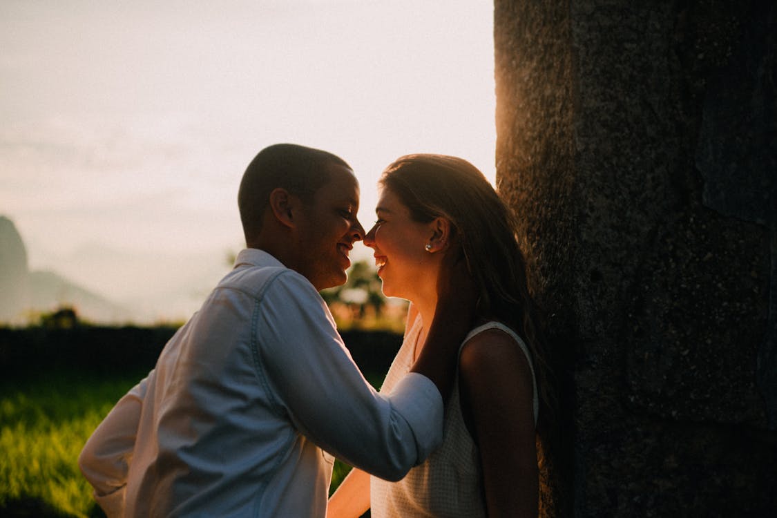 Photo Of Man And Woman Smiling