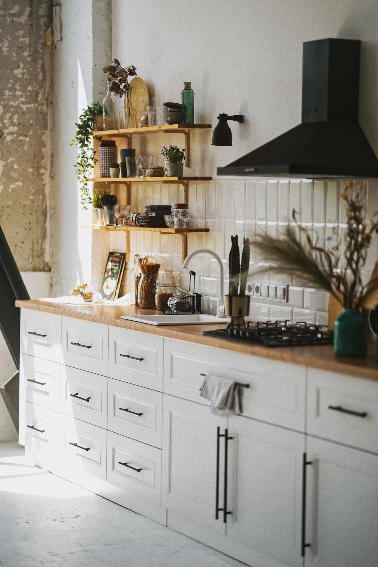 warm-mushroom-kitchen-cabinets White kitchen with wooden open shelves holding jars and plants