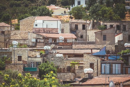 Discover the rustic beauty of Pano Lefkara village with its traditional stone houses and lush greenery.