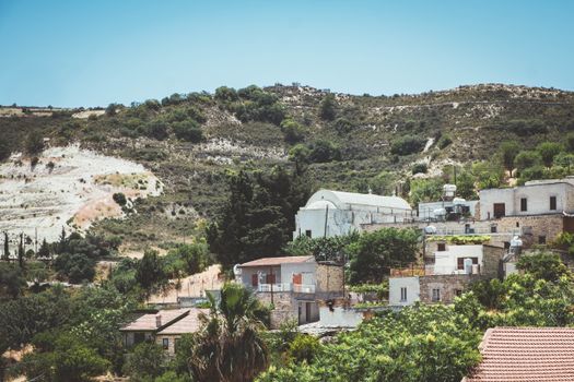 Picturesque Pano Lefkara village landscape in Cyprus with traditional buildings and lush greenery.