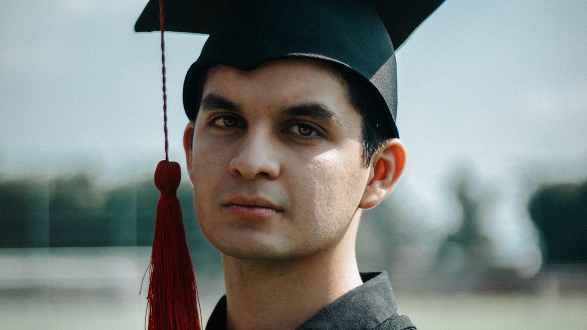 University graduation cap tossed in the air