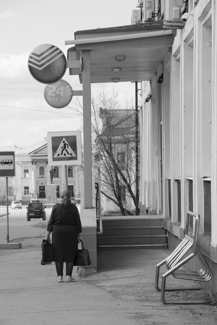 Woman With Bags In City