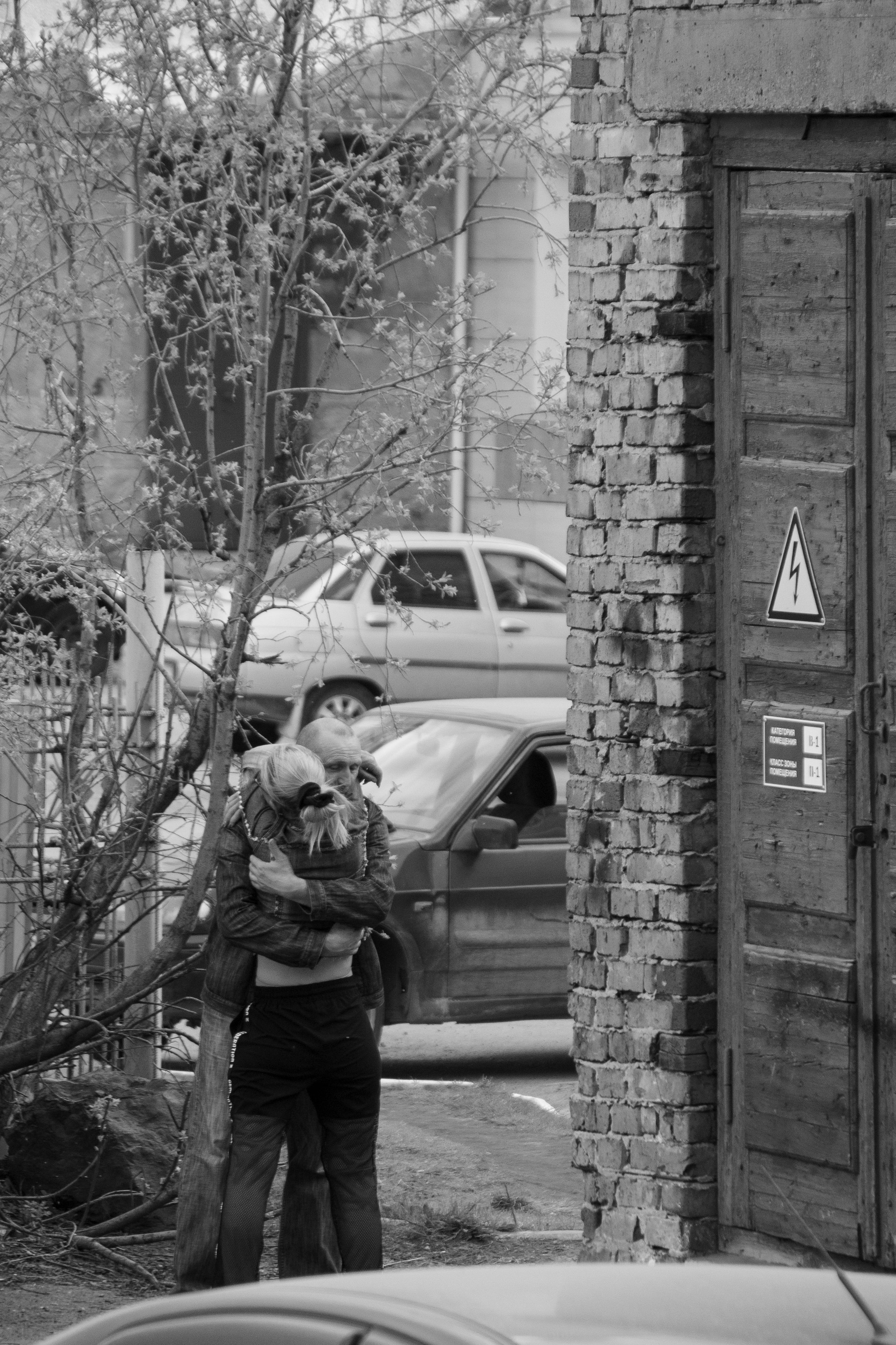 A Couple Hugging Near Buildings · Free Stock Photo