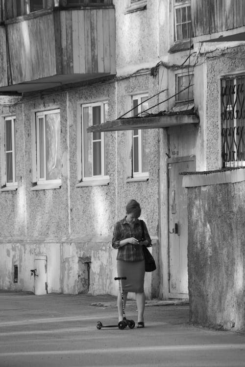 A Woman Standing Near a Trolley