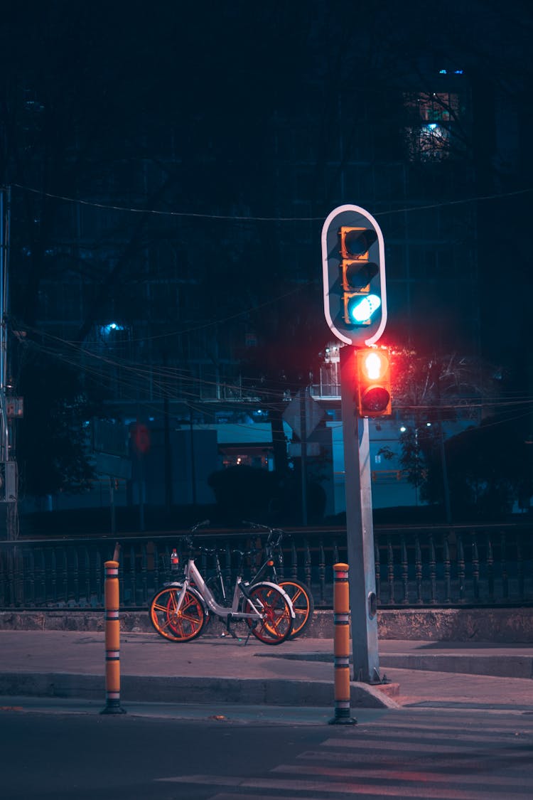 Traffic Lights On Road At Night