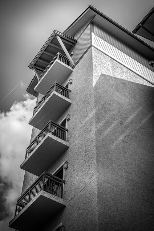 Grayscale Photo of Building with Balconies