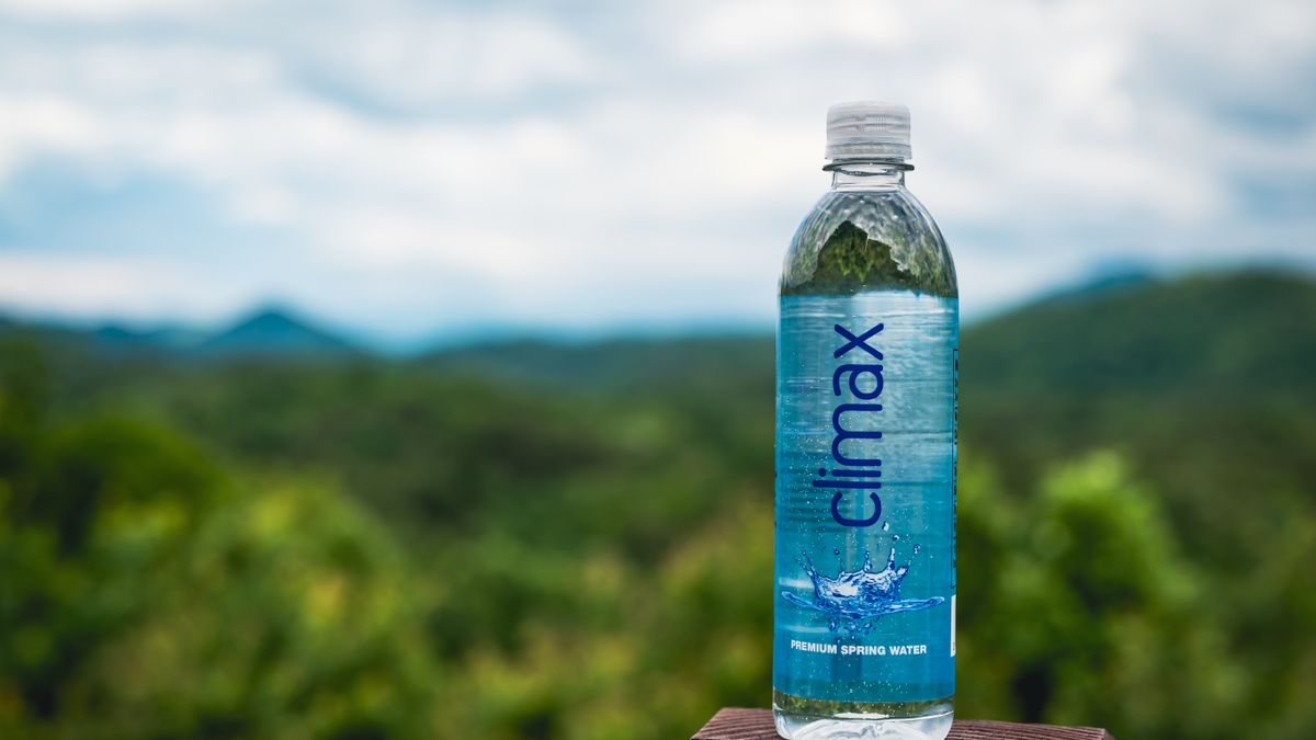 Nanoplastics in drinking water bottle sitting on a wooden surface