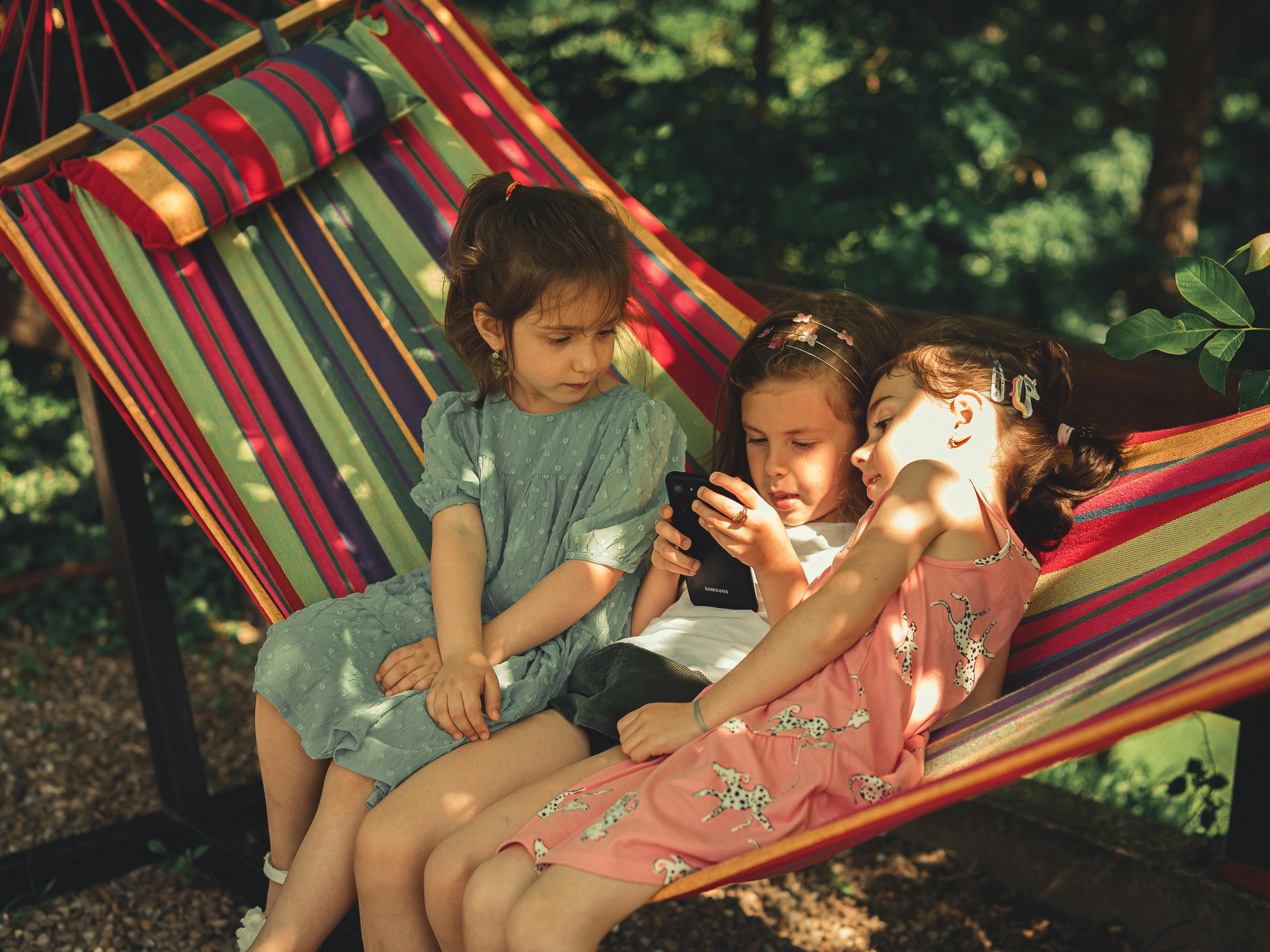 Free Girls Sitting on a Hammock Stock Photo