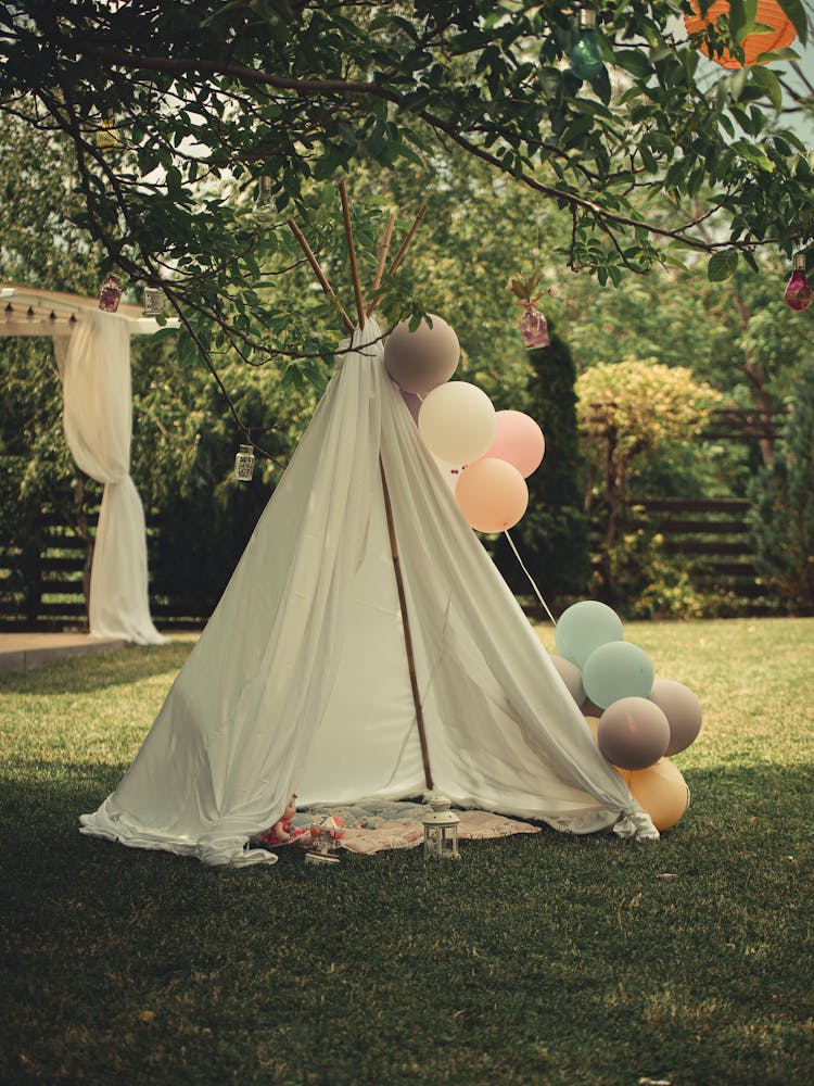 A White Tent With Balloons 