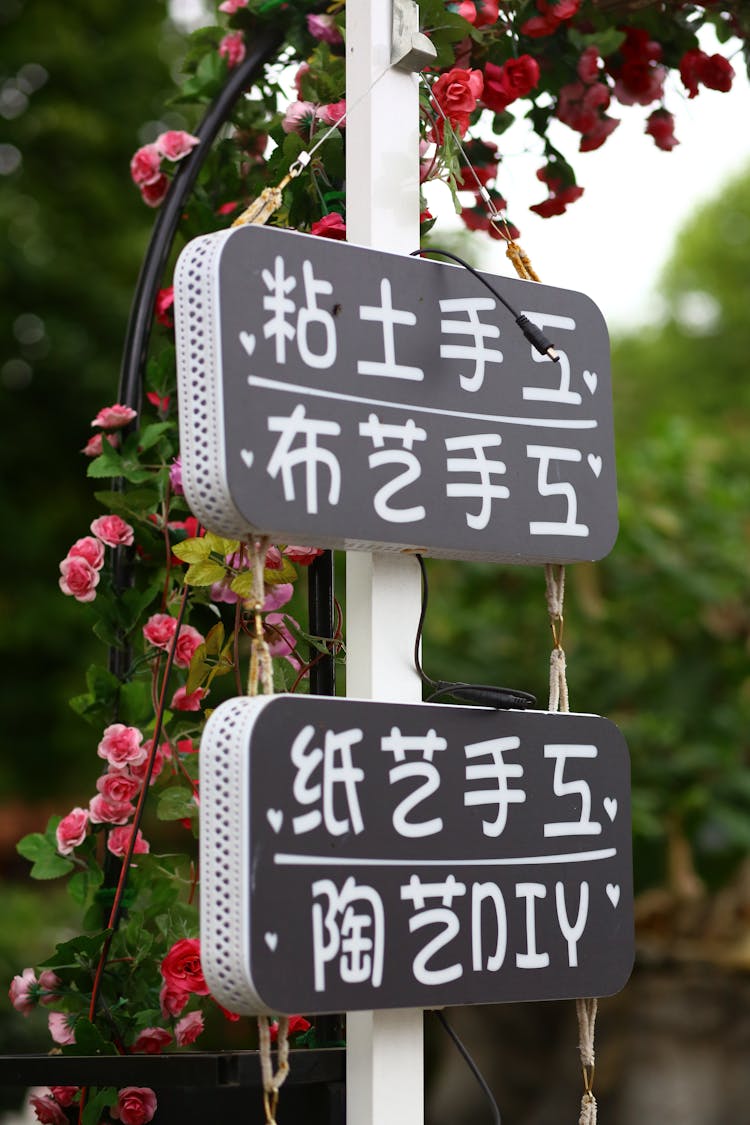 Signage Hanging On A Post