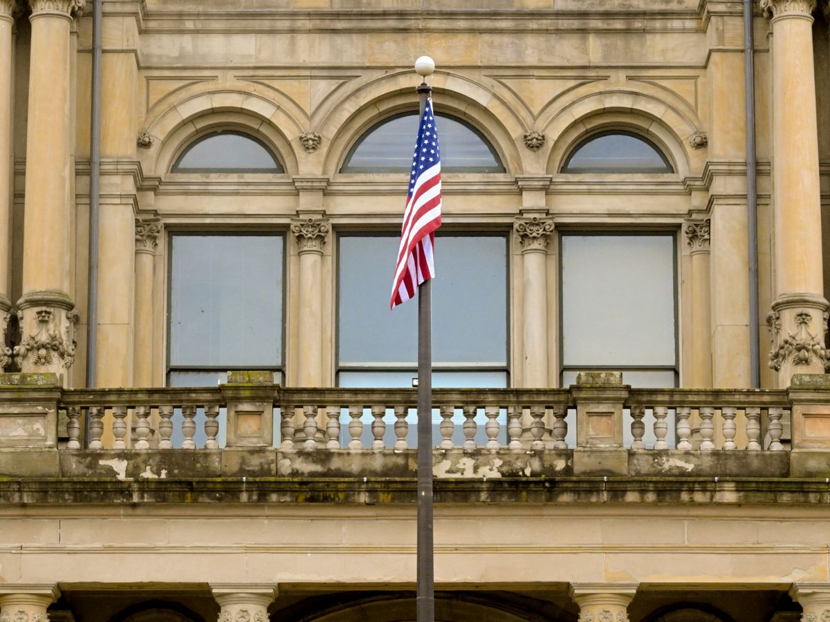 A courthouse interior with the judge's bench and columns