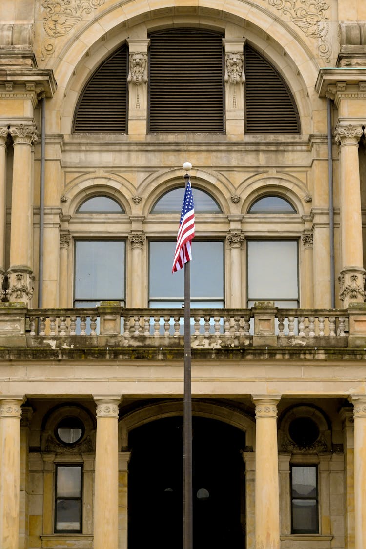 American Flag And Building Terrace Behind