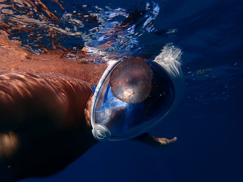 Man Swimming Wearing Full-face Snorkelling Mask