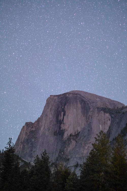 Free Half Dome under a starry sky in Yosemite National Park, California. Stock Photo