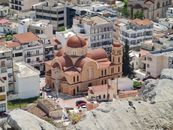 A stunning aerial shot of Saint Andreas Church amidst Salamina city buildings.
